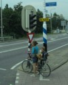 Typical Mom with two kids on her bicycle